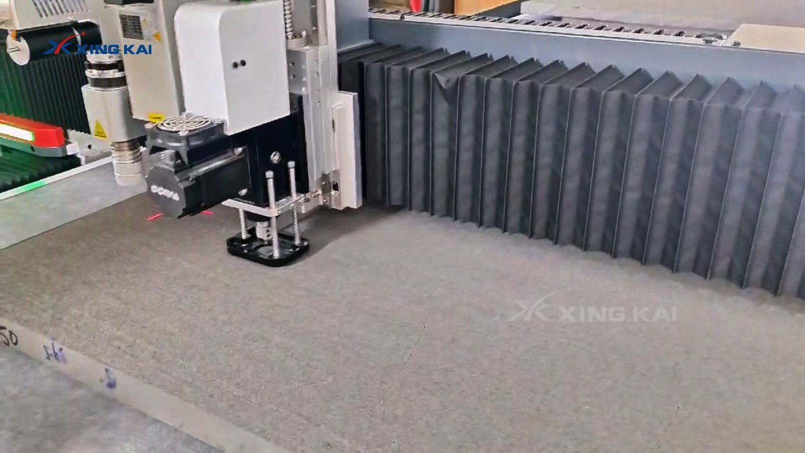 CNC oscillating knife cutting a thick sponge foam sheet