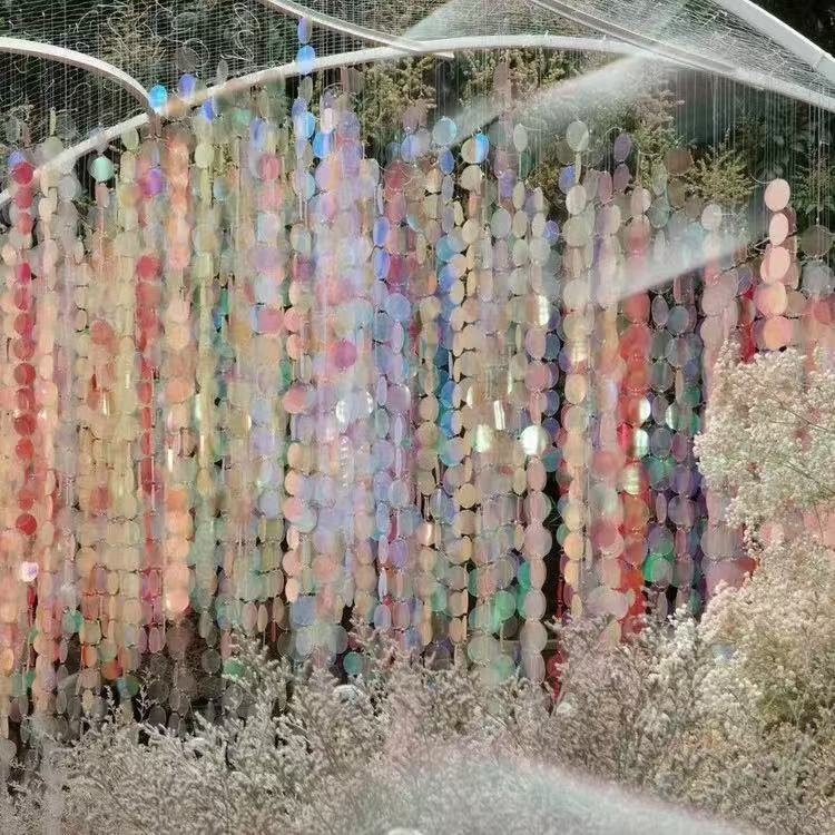 Pastel iridescent sequin hanging backdrop for a wedding setting