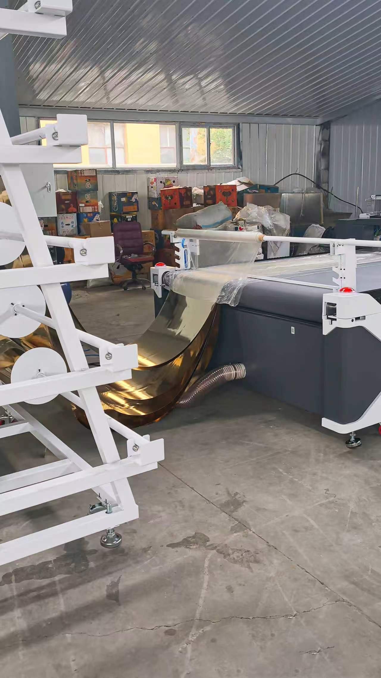 Roll-fed reflective wedding decor material on a CNC oscillating knife cutting table
