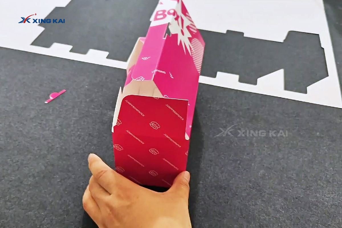 Folded printed white cardboard packaging box sample