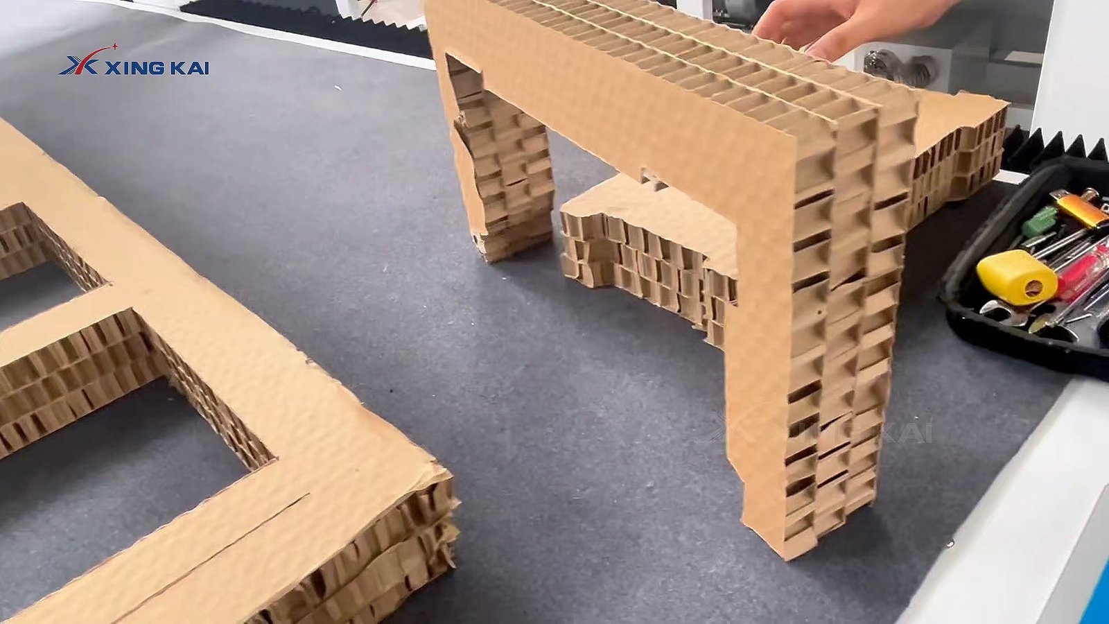 Corrugated cardboard packaging samples cut on a XING KAI CNC machine
