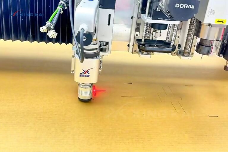 Oscillating knife cutting corrugated cardboard on a CNC cutting machine